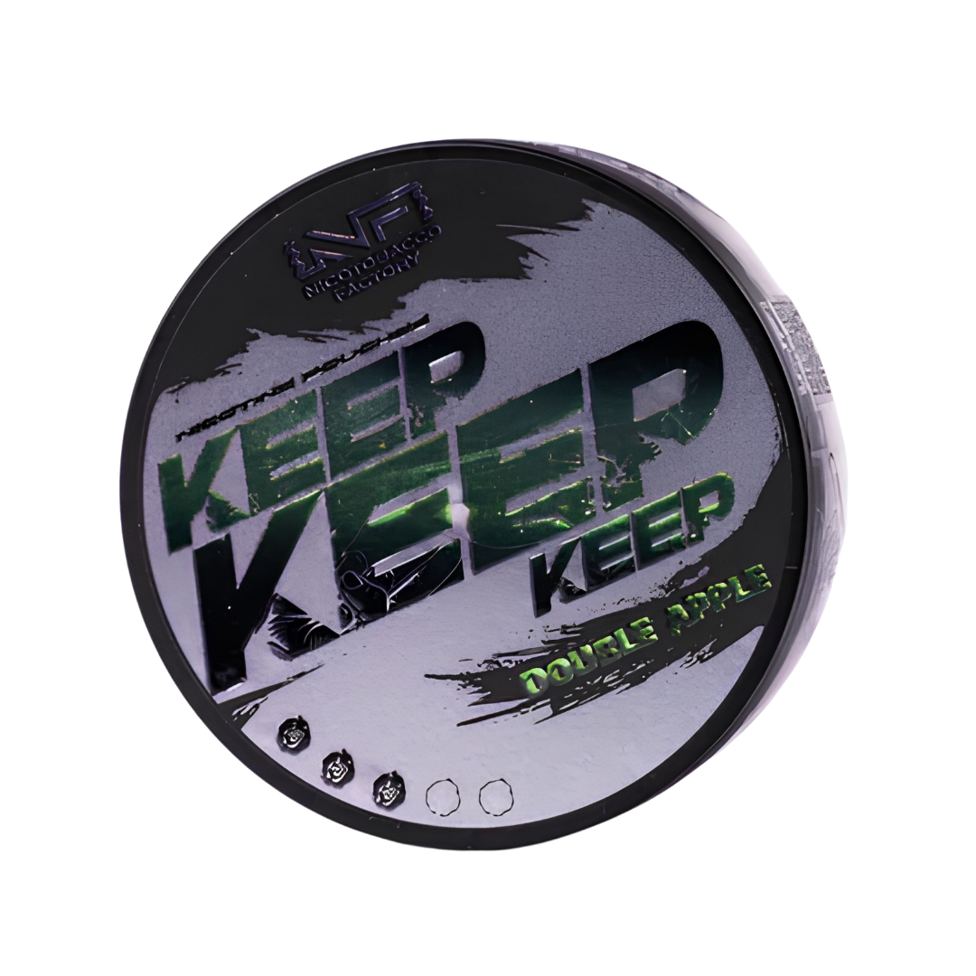 Detail close-up of Keep Double Apple packaging featuring a round container with bold black, green, and white text.