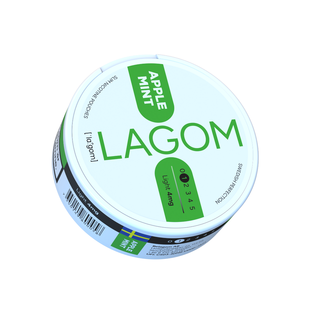 Detail close-up of the Lagom nicotine pouch container in white and green with a screw top and label text.