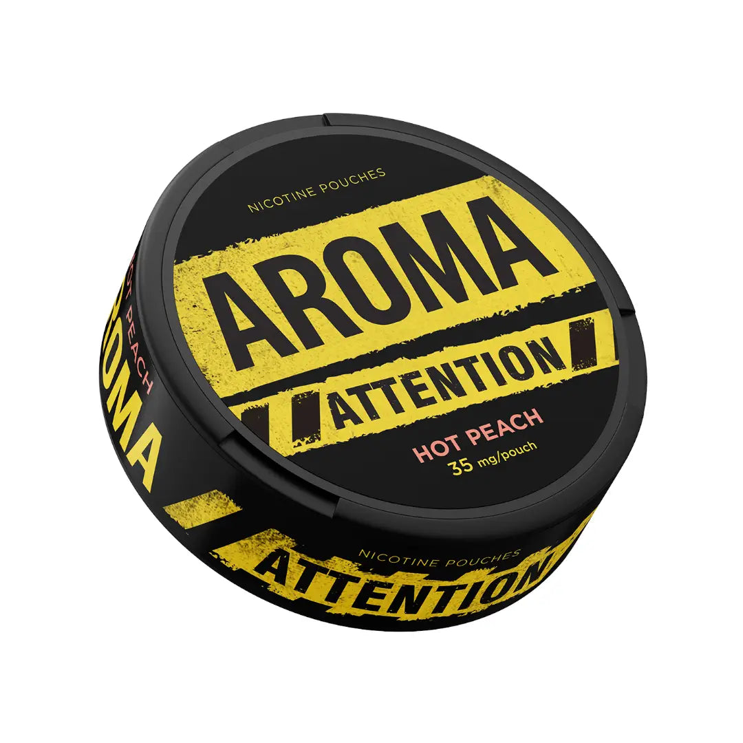 A close-up of Aroma Attention Hot Peach snus pouch from Killa Snus, showing the pouch's peach flavor and branding.