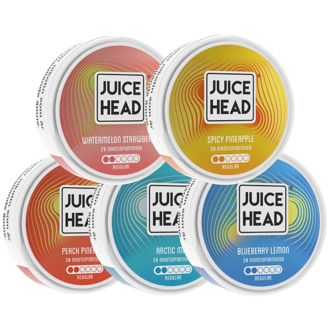 Assorted Juice Head e-liquid bottles in the Mixpack from Europesnus.com, featuring vibrant fruit flavor labels and packaging.