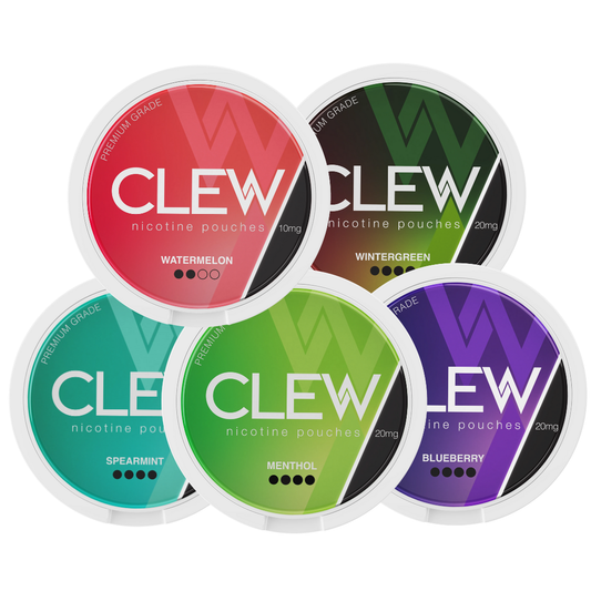 Variety of Clew Mixpack containers in red, green, black, and purple with circular designs on a white background.