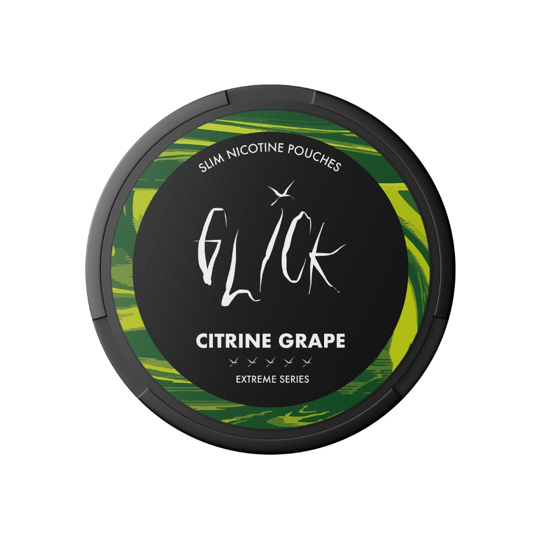 Detail close-up of the Glick Citrine Grape container featuring the round design and label in black, green, and yellow.