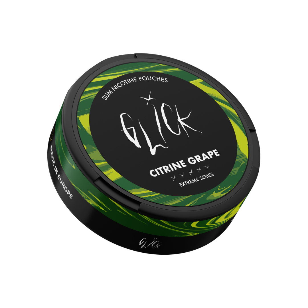 Detail close-up of the Glick Citrine Grape container showcasing its round design in black, green, and yellow.