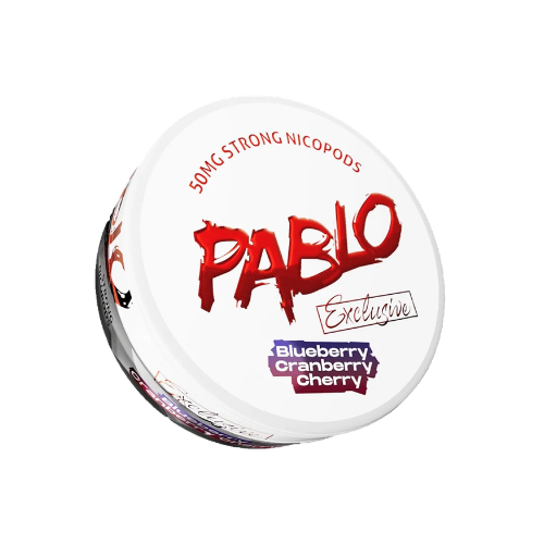 Detail close-up of a round white and red container of Pablo Exclusive Blueberry Cranberry Cherry nicotine pouches with gra…