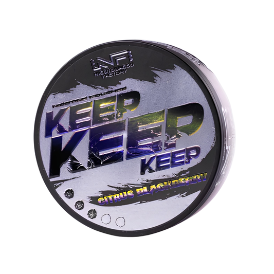 Detail close-up of a circular black and purple container with yellow text design, showcasing Keep Citrus Blackberry.