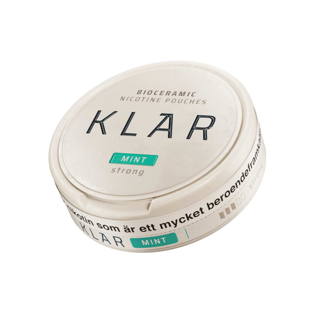 Detail close-up of the round teal Klar Mint Strong Mini container with a screw top on a white background