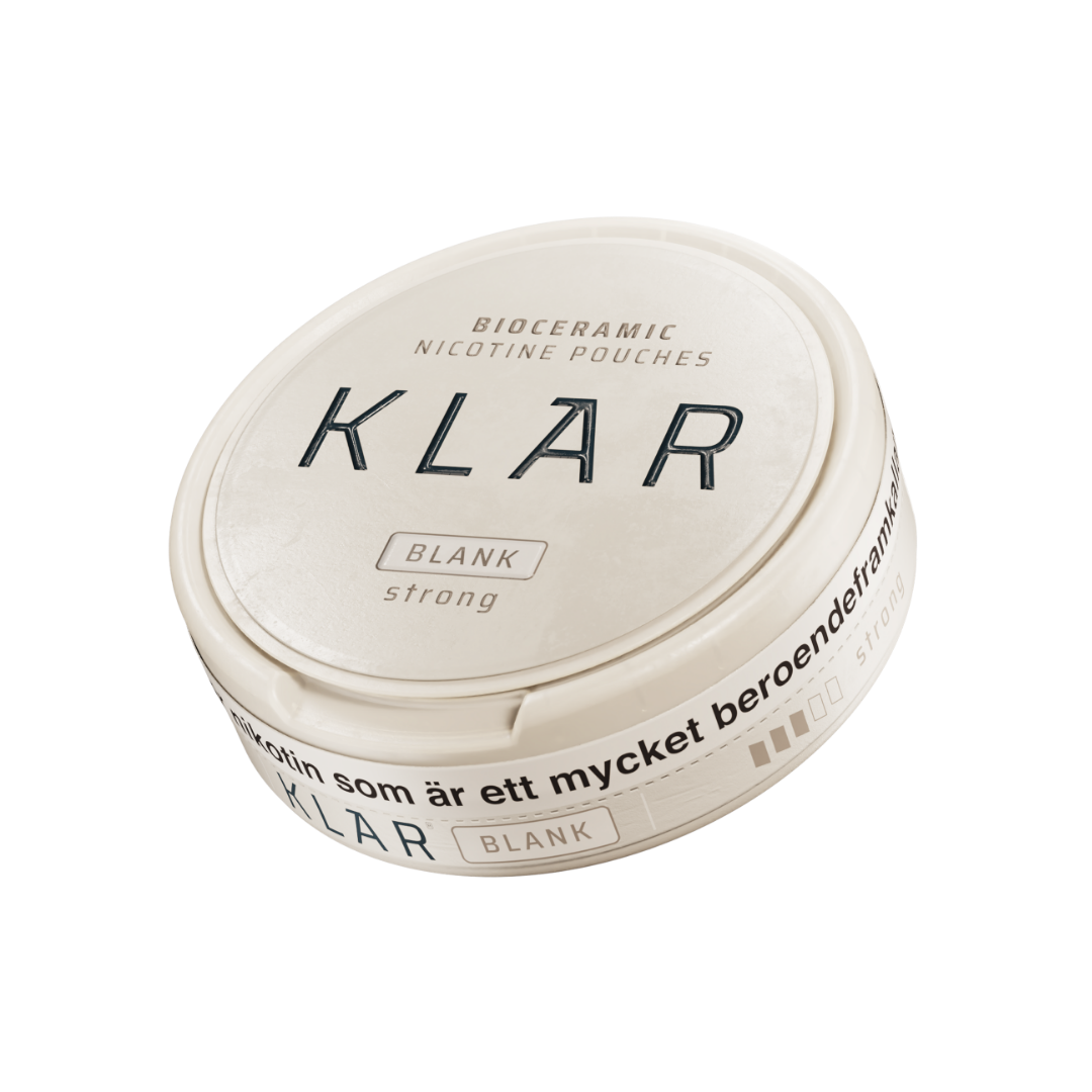 Detail close-up of the round white container with a black label and screw top for Klar Blank Strong Mini