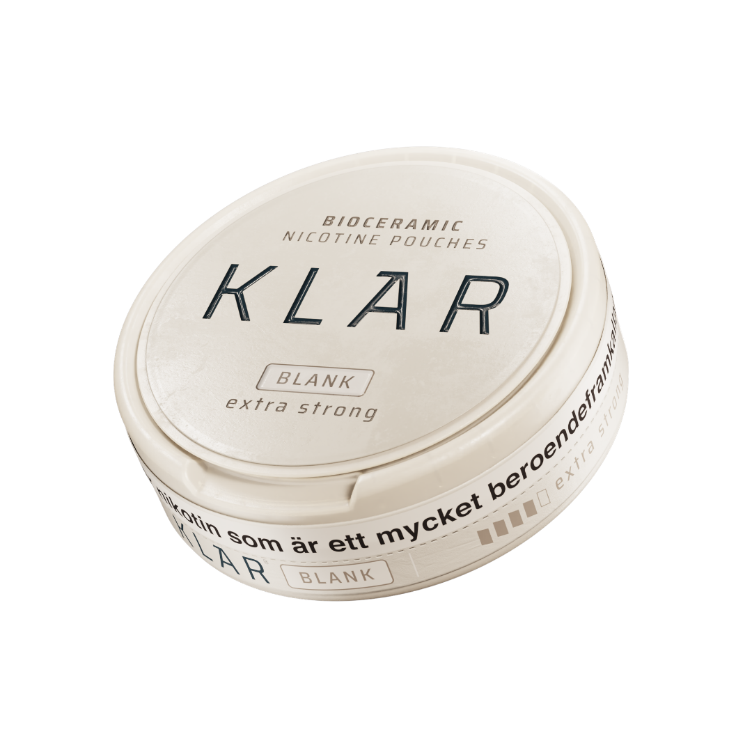Detail close-up of the round container of Klar Blank Extra Strong Slim, featuring a smooth white and black label on a whit…
