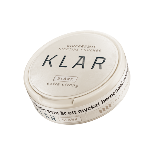 Detail close-up of the round container of Klar Blank Extra Strong Slim, featuring a smooth white and black label on a whit…