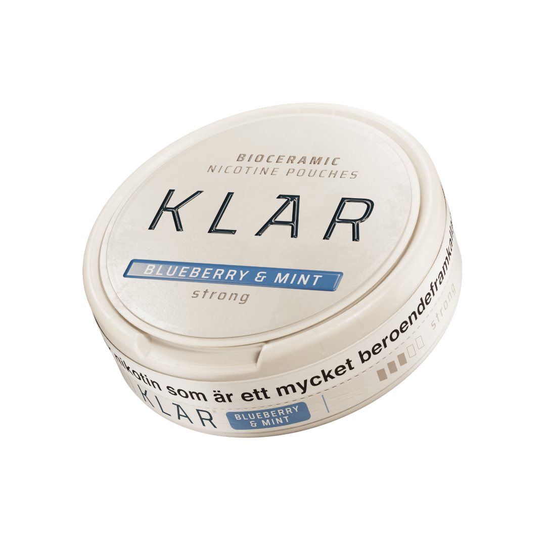 Detail close-up of the round Klar cream container with a blue label on a white background