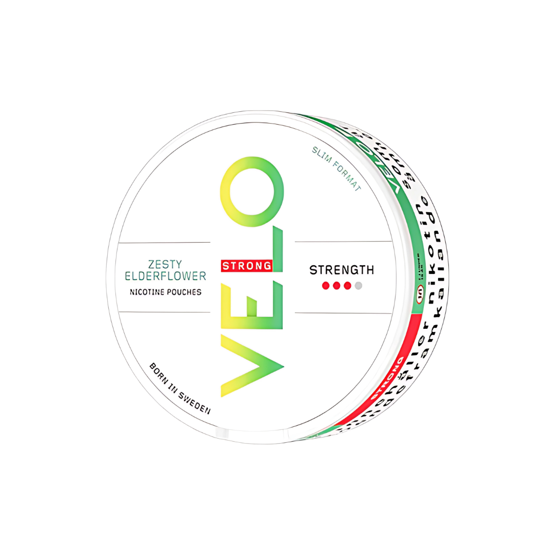 Detail close-up of the Velo Zesty Elderflower snus can featuring a white, green, yellow, and red flavor label.
