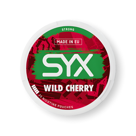 Detail close-up of the circular red and green lip balm container with cherry flavor indication on a white background