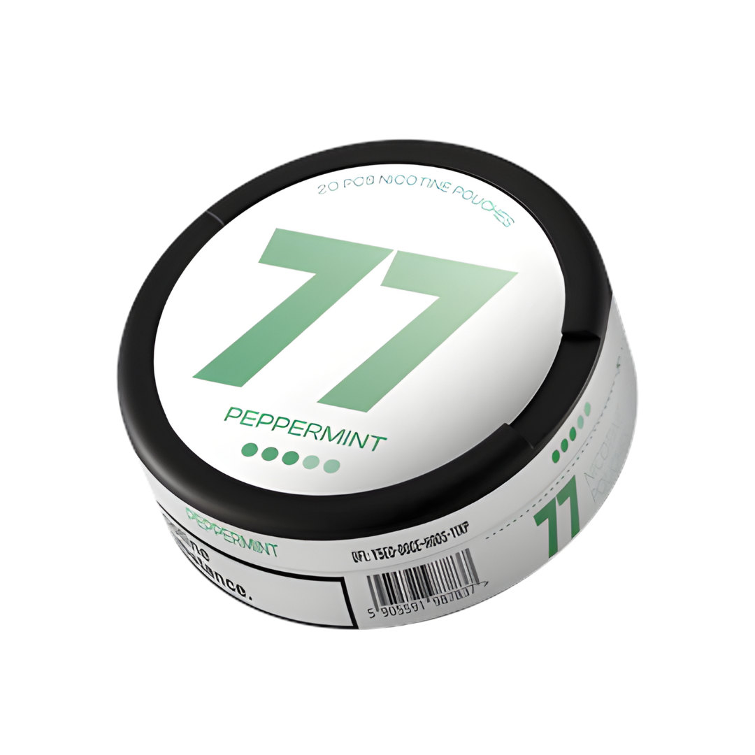 Detail close-up of the green and white circular container labeled with number 77, showcasing its smooth surface against a…