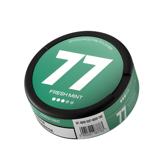 Detail close-up of a green circular container with a label featuring number 77, on a white background.