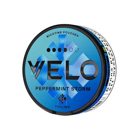 Detail close-up of the round black and blue snus can featuring logo text and graphic design on a transparent background.