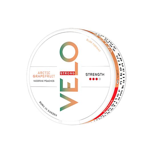 Detail close-up of the circular snus can featuring white, orange, and green colors with flavor label and brand logo