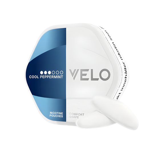 Packaging of VELO Shift Cool Peppermint snus can, featuring a hexagonal shape in white and blue with brand logo.