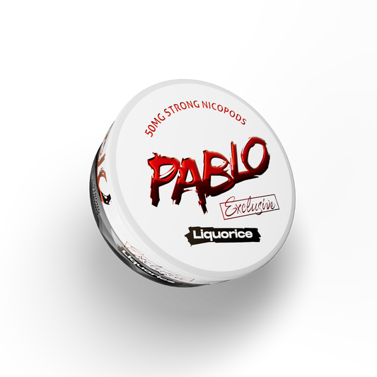 Front view of Pablo liquorice tin in black, white, and red with logo text and round shape.