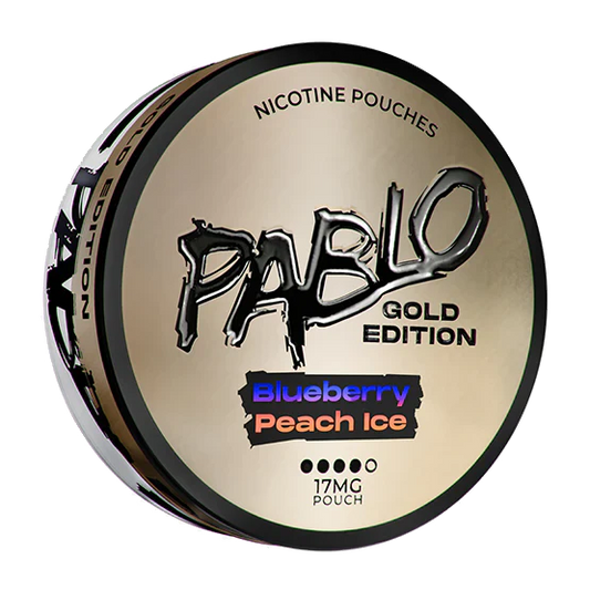 Front view of Pablo Gold Edition in a round tin featuring gold, black, blue, and peach colors with bold text.