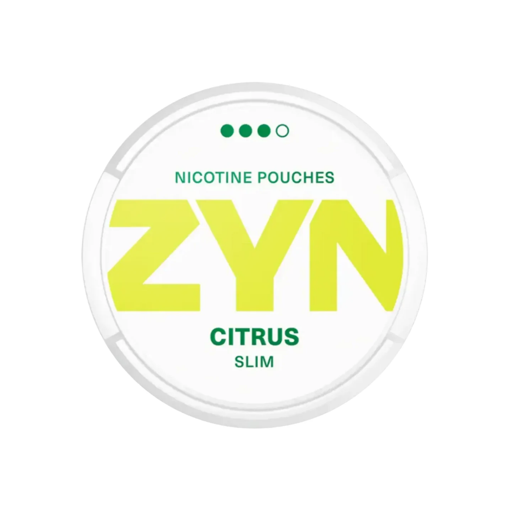 Detail close-up of Zyn Citrus Strong Slim pouch in a round container, showcasing vibrant yellow and white colors.