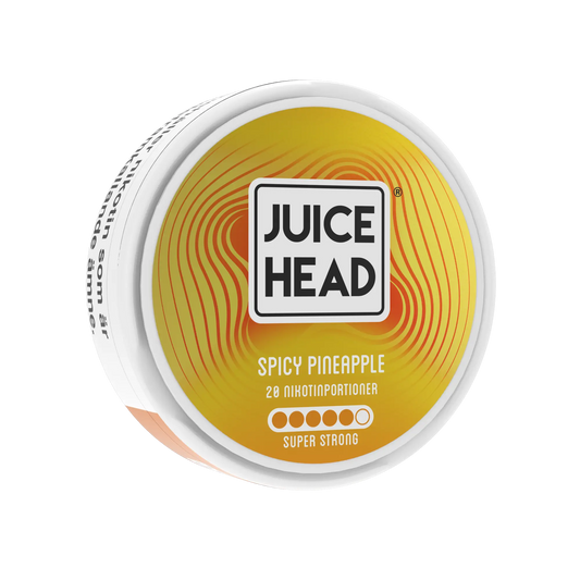 Juice Head Spicy Pineapple super strong vape juice bottle with label, featuring pineapple flavor and 14mg nicotine strength.