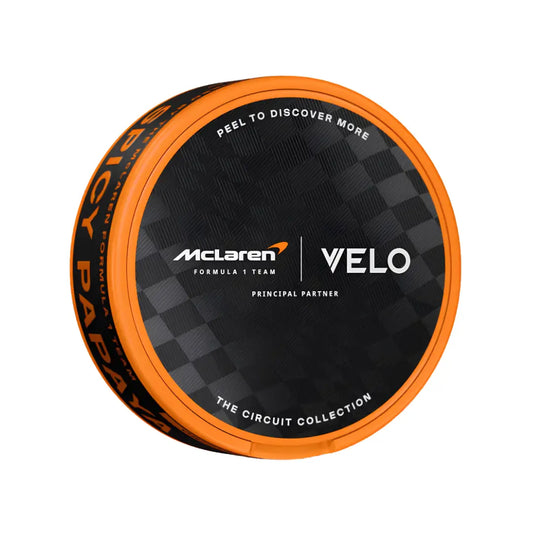 Velo McLaren Spicy Papaya Slim snus can with sleek packaging, featuring spicy papaya flavor branding and slim pouch design.