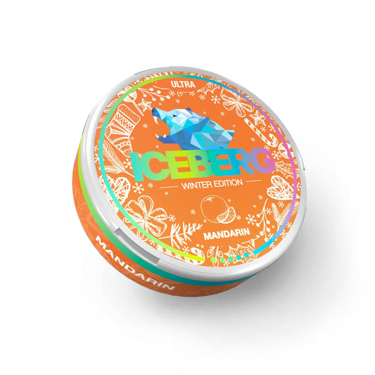 Detail close-up of the orange circular tin of Iceberg Mandarin Snus featuring a colorful design on a white background